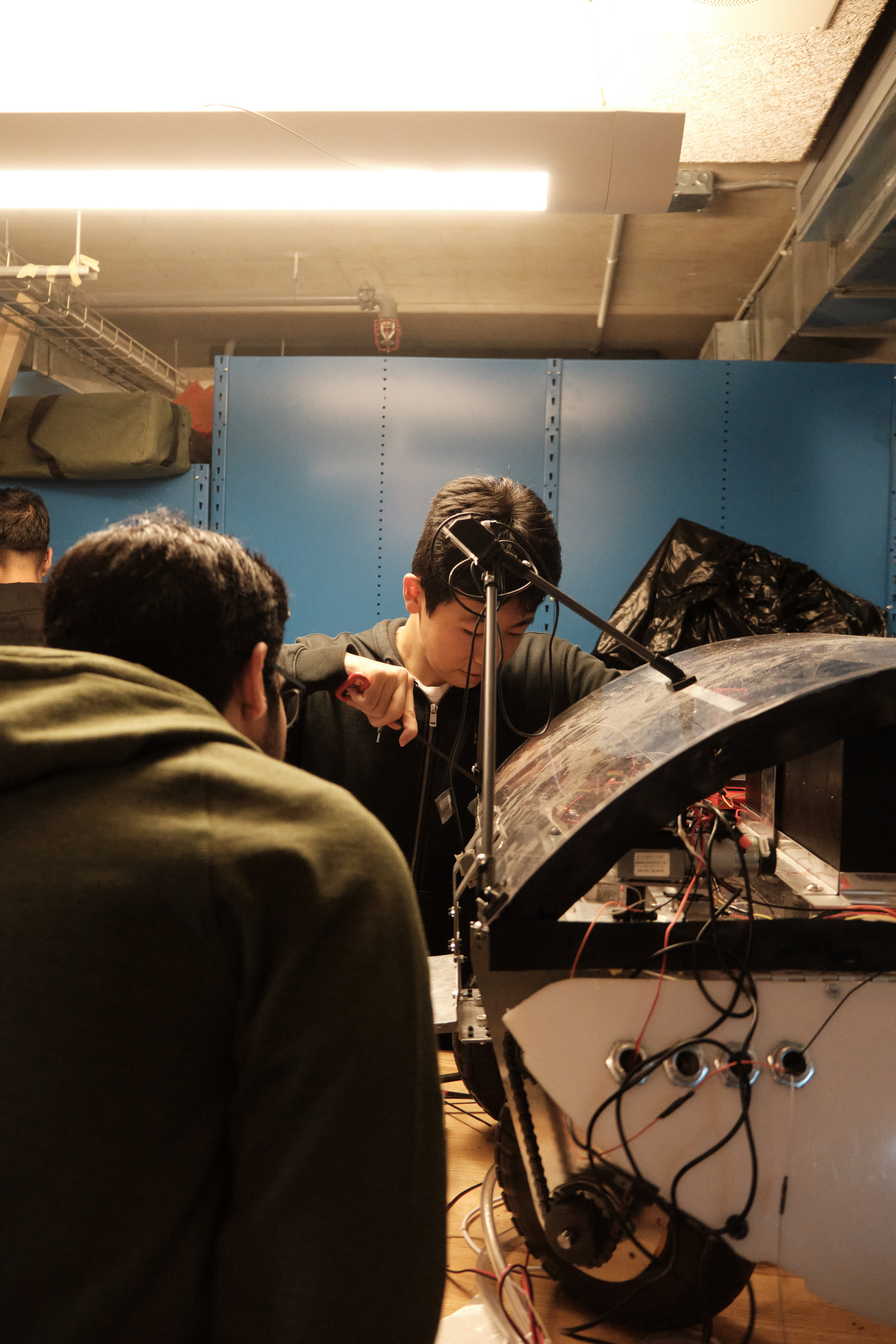 Team members assembling the robot chassis in the workshop